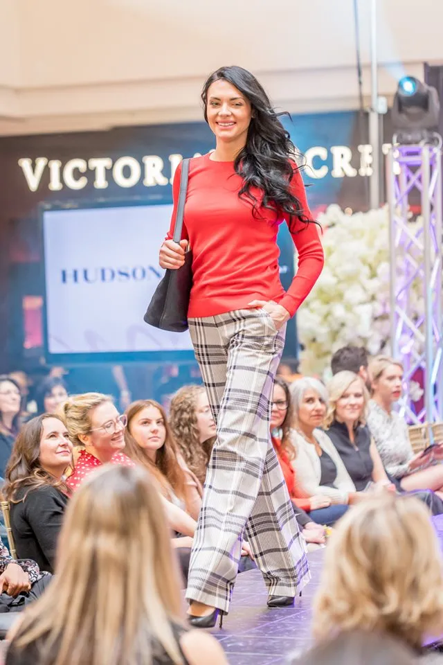 Fashion show event creative with lighting, stage and branded visuals