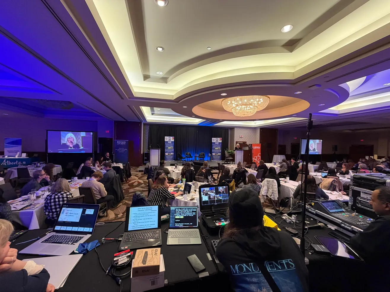 Corporate event production setup with screens, staging and AV support